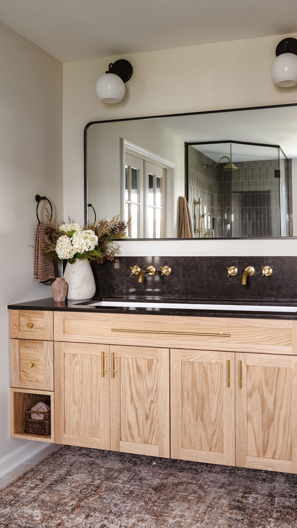 Spa-inspired walk-in shower with taupe tile and floor-to-ceiling glass enclosure Spa-inspired walk-in shower with taupe tile and floor-to-ceiling glass enclosure