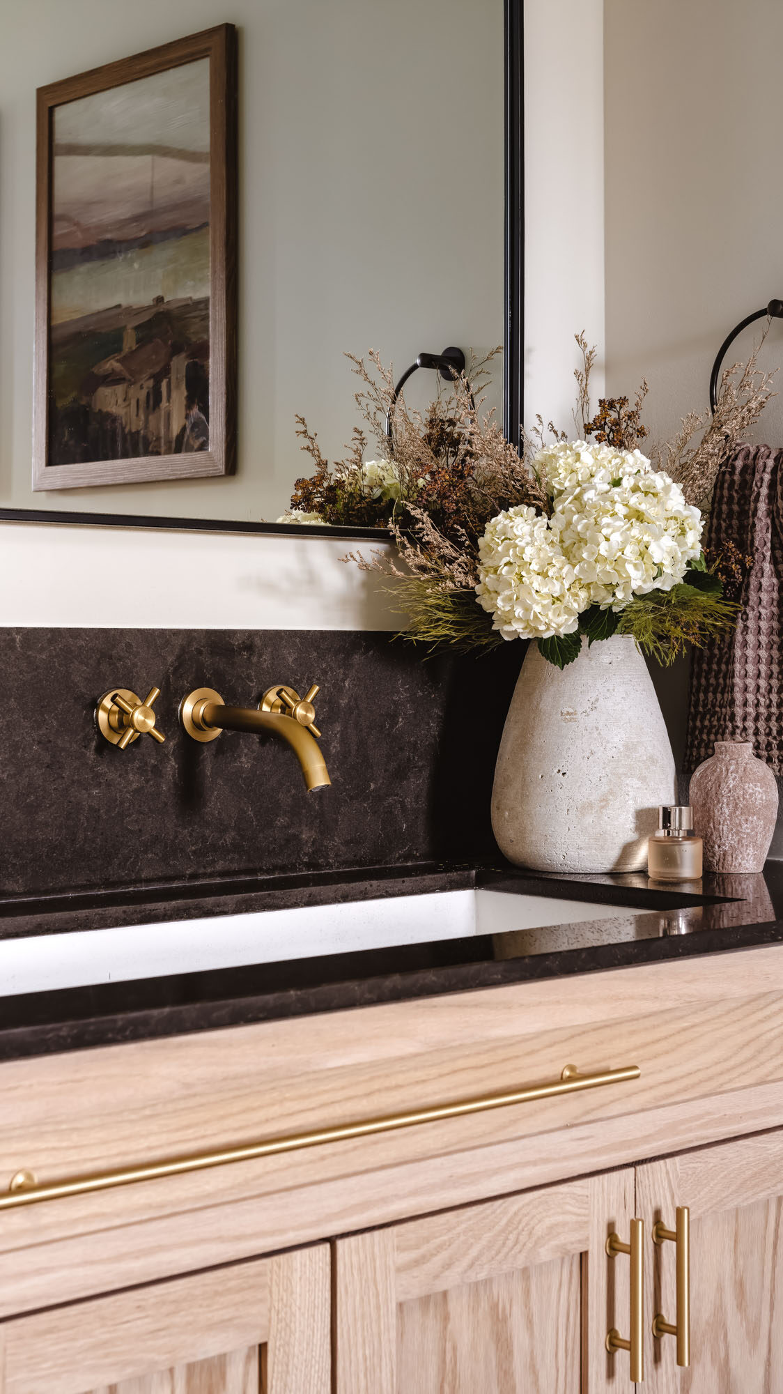 Custom floating oak vanity and wall mount faucets in Maple Grove primary bathroom remodel Custom floating oak vanity and wall mount faucets in Maple Grove primary bathroom remodel